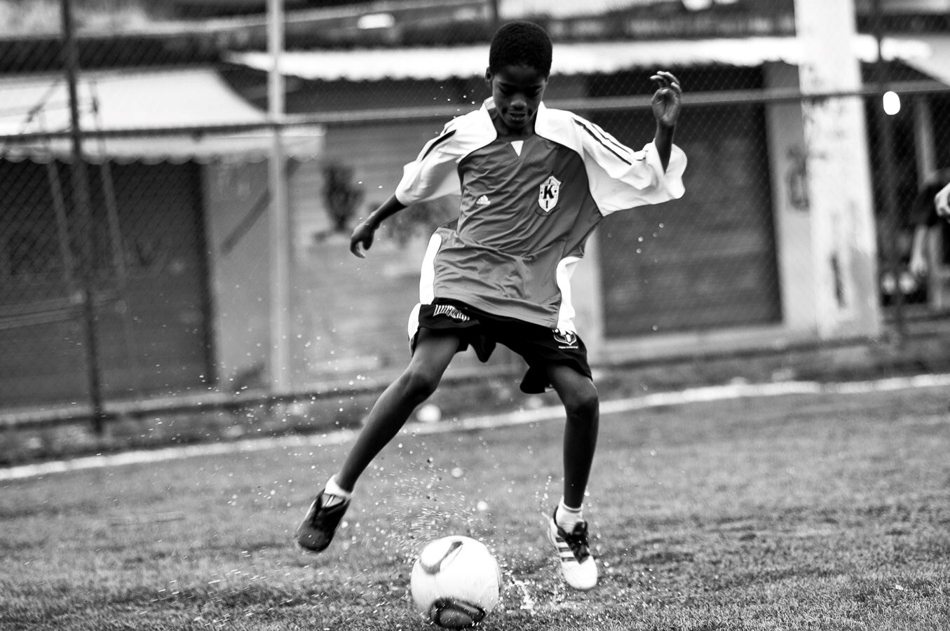 Boy that plays with fotball.